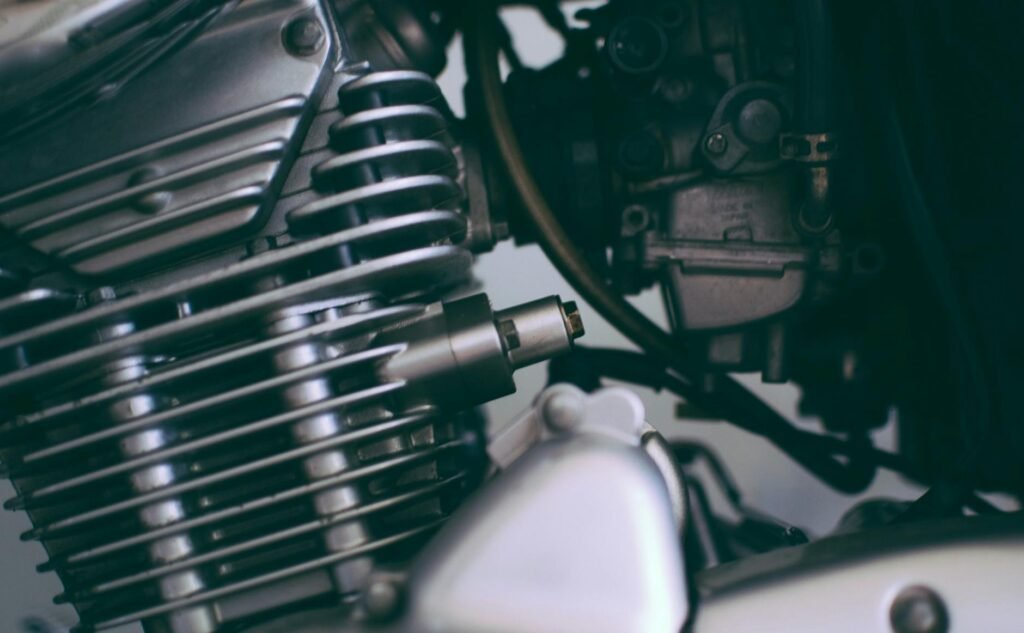 Detailed close-up of a shiny motorcycle engine showcasing metal components.