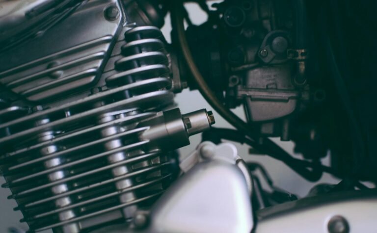 Detailed close-up of a shiny motorcycle engine showcasing metal components.