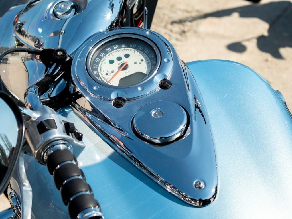 Detailed image of a motorcycle speedometer, handlebar, and fuel tank in Wrocław, Poland.