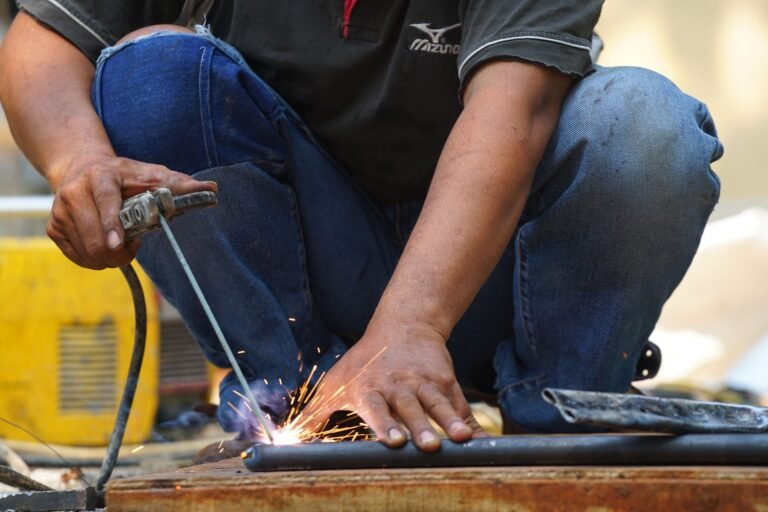 A welder at work in South Jakarta, Indonesia, demonstrating skill and precision.